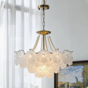 Four-layer Pertid chandelier suspended in modern home interior with warm lighting and art wall