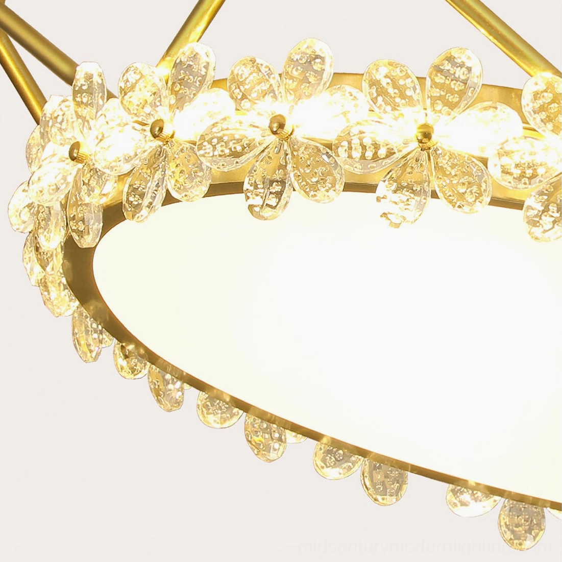 Close-up macro photography of delicate crystalline petal flowers on gold ceiling lamp, showcasing precision crystal cutting