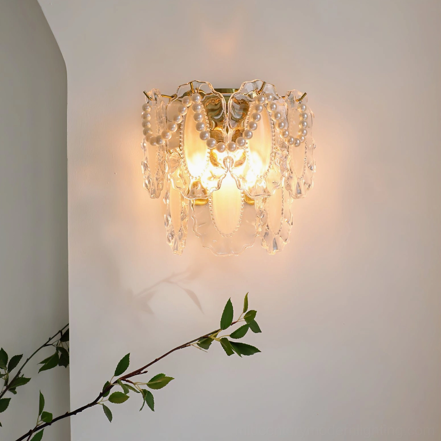 Petal Pearl Wall Light mounted on interior wall with warm illumination and plant decor