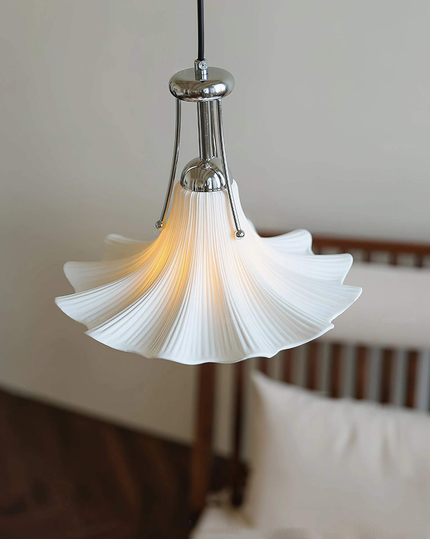 Petalia white ceramic pendant shade with chrome hardware, close-up unlit view in bedroom setting