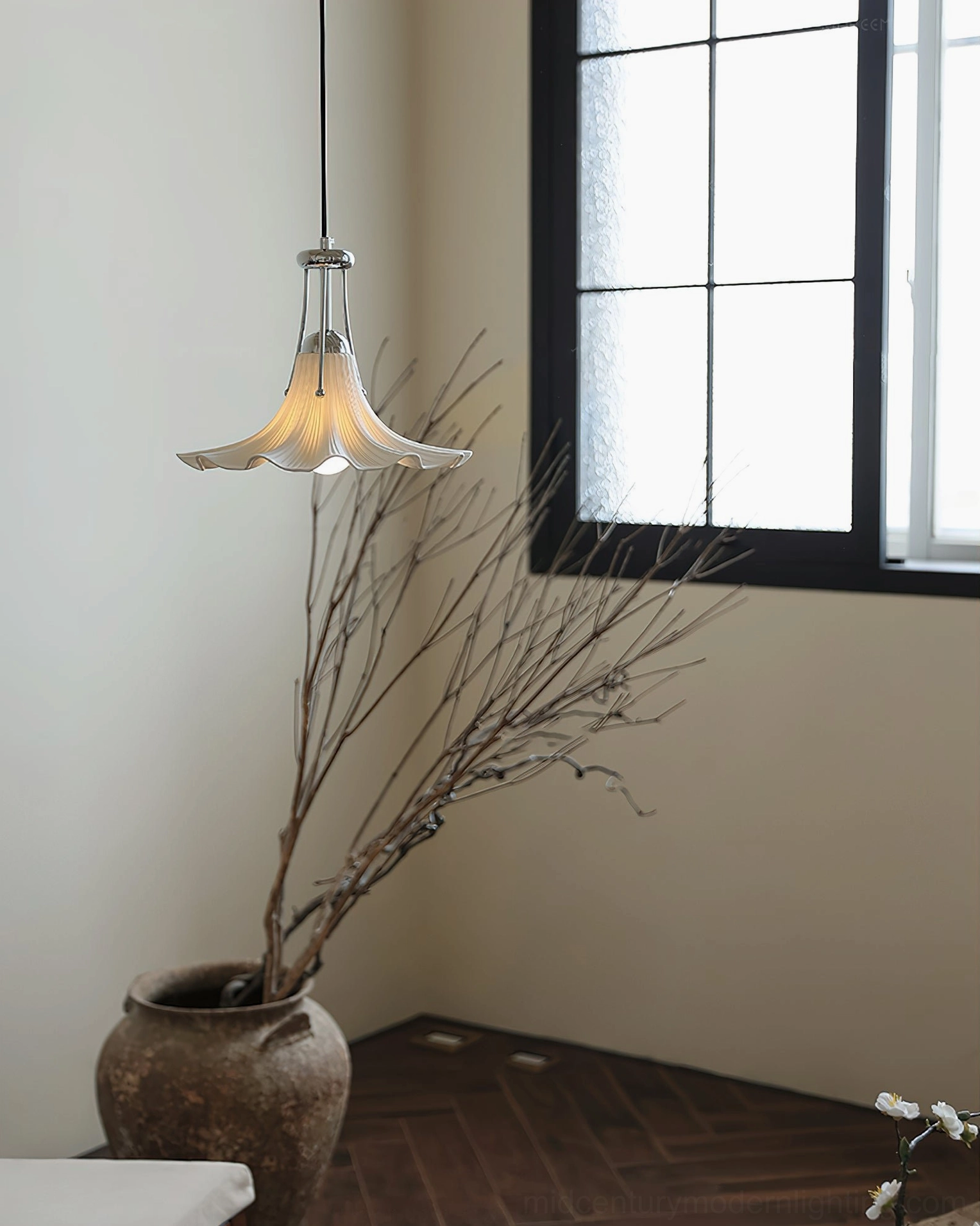 Petalia floral pendant light in japandi-inspired room with dark window frames and calm atmosphere