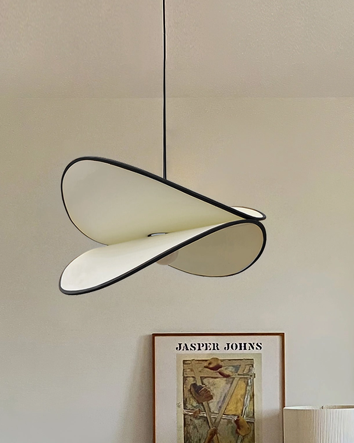 Close-up overhead view of Petalo pendant lamp unlit showing twisted petal silhouette