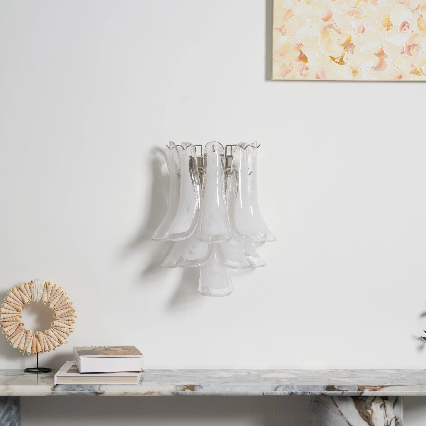 Petral wall sconce with clear frosted glass petals in contemporary living space, demonstrating soft diffused lighting
