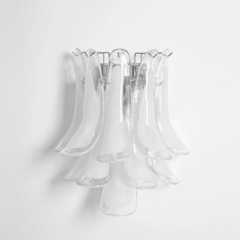 Petral wall sconce with clear hand-blown glass petals and sleek metal hardware, modern minimalist design