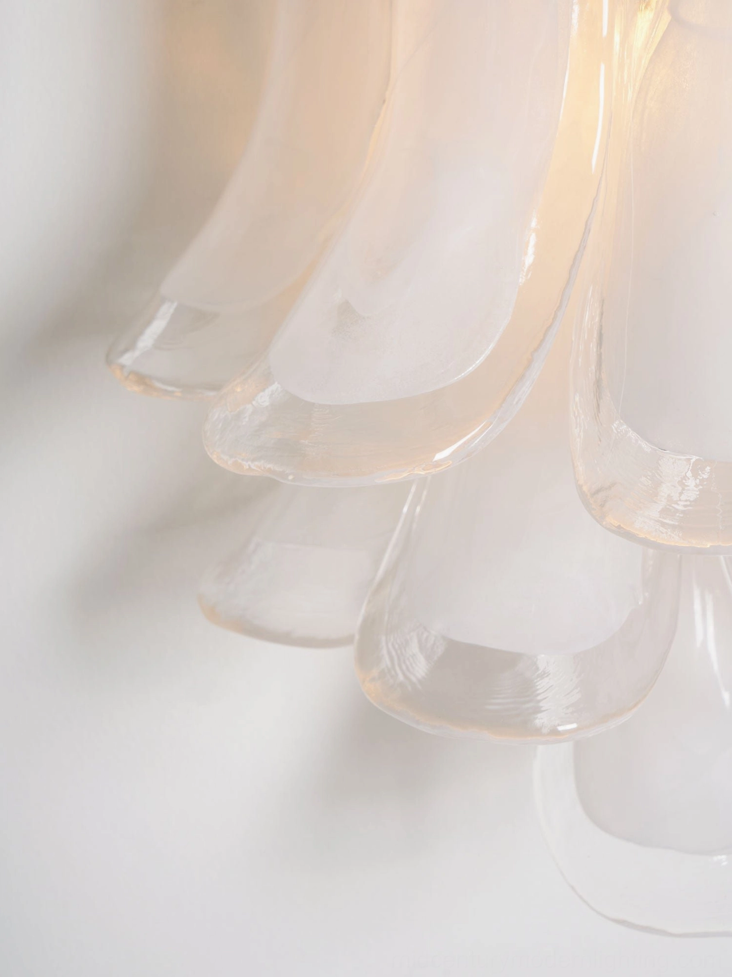 Petral wall-mounted sconce with sculptural glass design and brushed nickel finish in modern interior