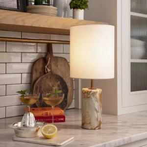 Pharos table lamp styled on contemporary kitchen countertop with barware and minimalist decor