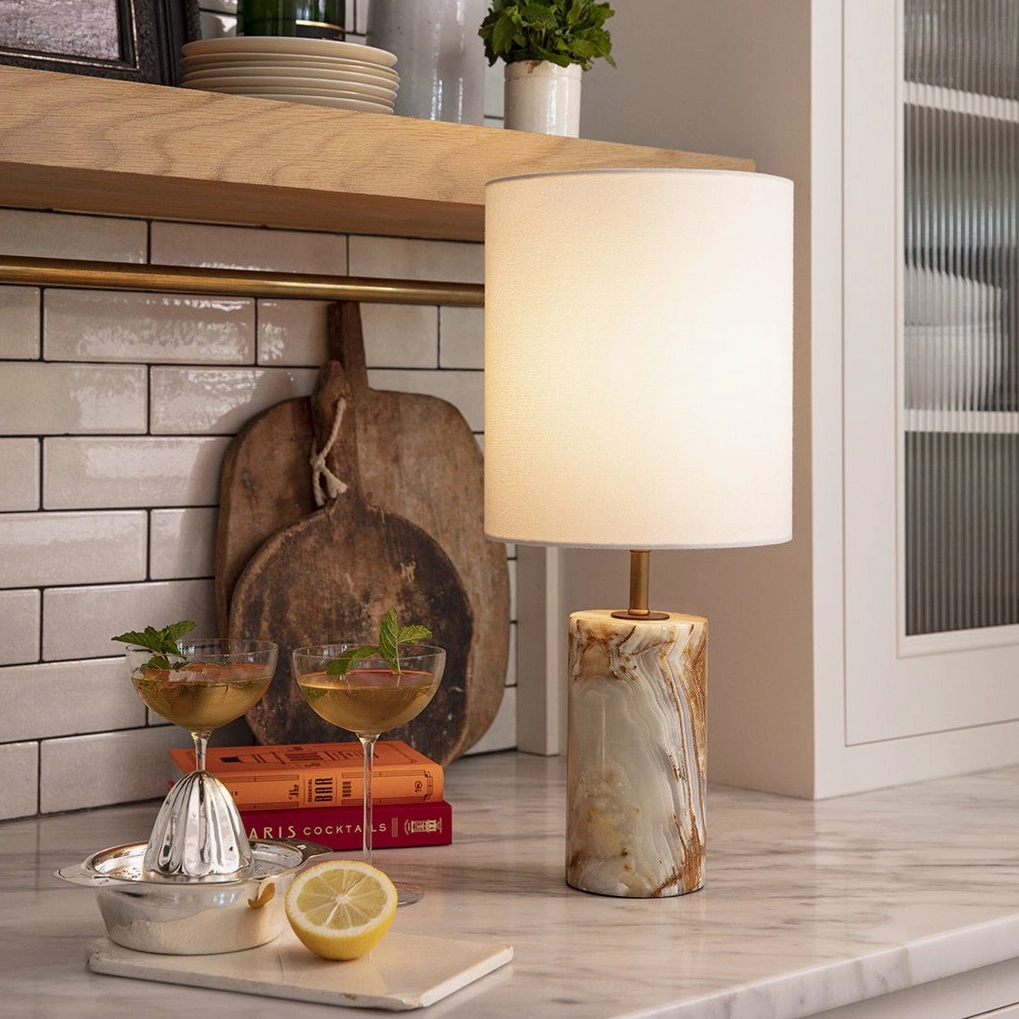 Pharos table lamp styled on contemporary kitchen countertop with barware and minimalist decor