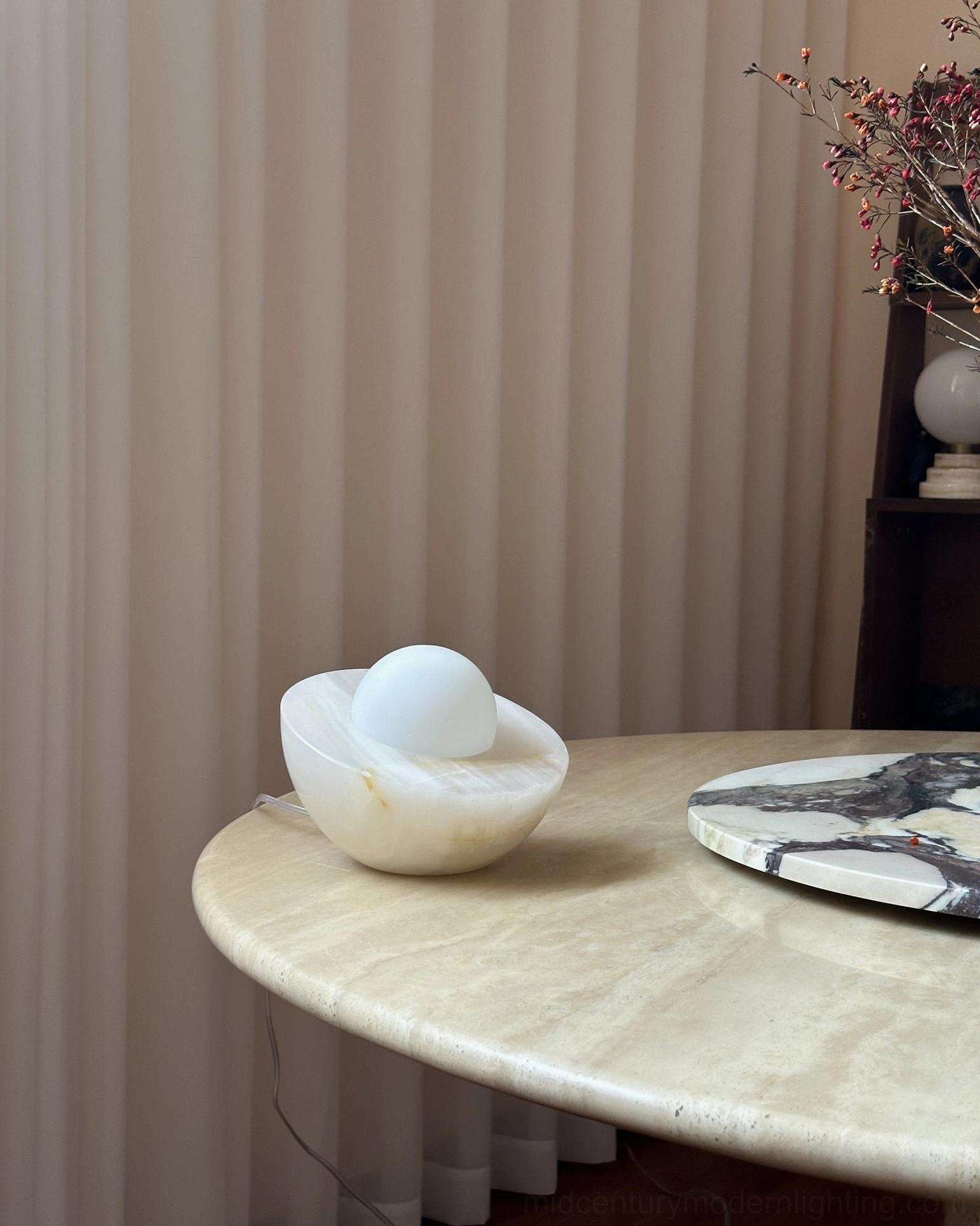 Piccola marble orb lamp styled on side table with dried flower arrangements and marble tray, minimalist modern interior decor