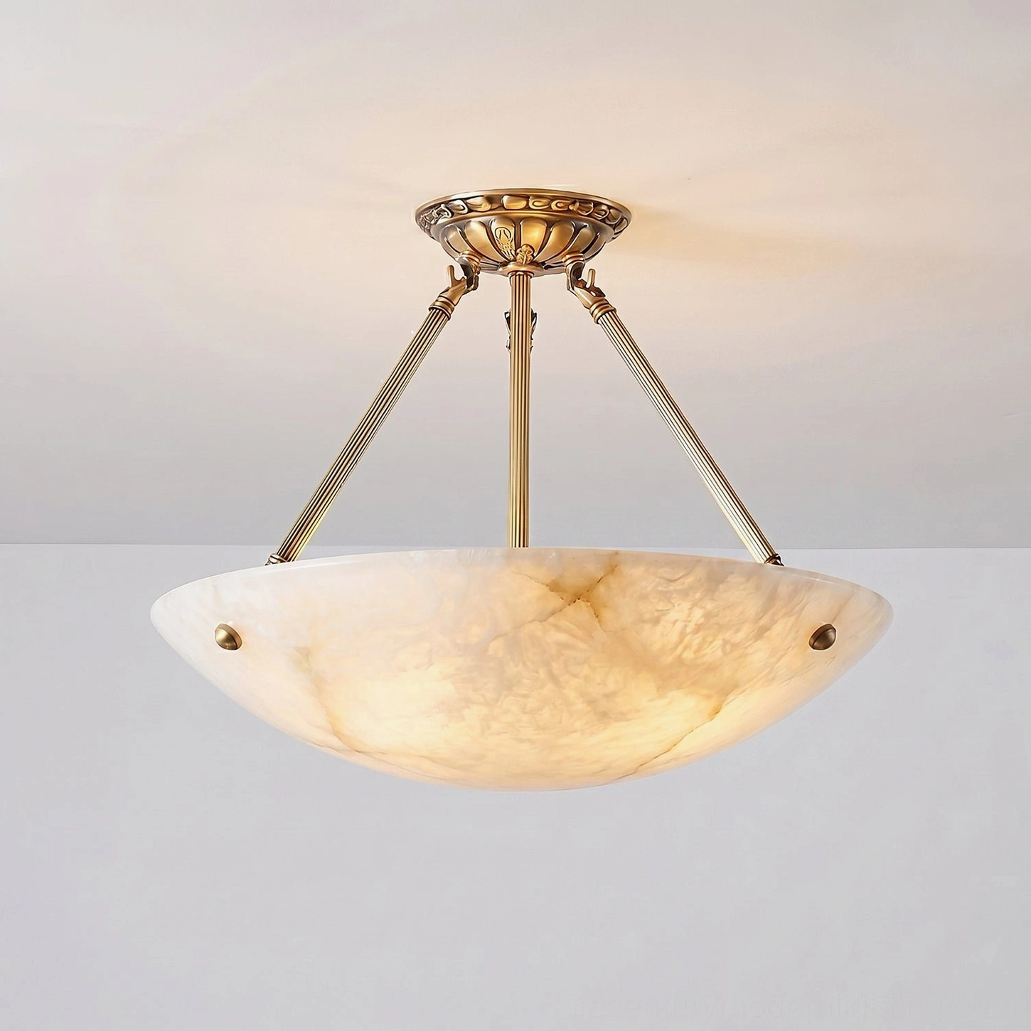 Piedmont alabaster bowl pendant ceiling light showing refined craftsmanship with natural stone carving and brass frame construction