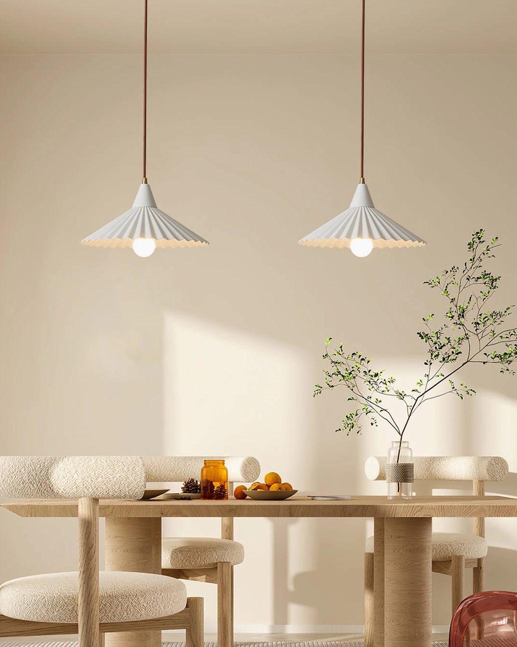 Two white Pieghe pleated pendant lights suspended above long wooden dining table with upholstered chairs