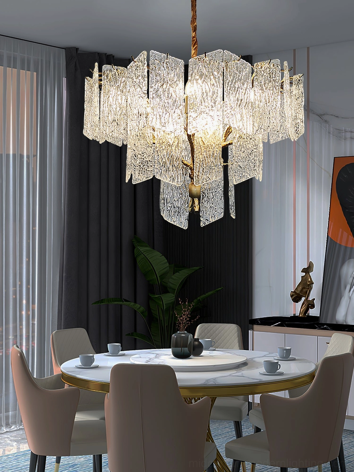 Piemonte brass chandelier illuminating contemporary dining room above matching gold branch-style furniture