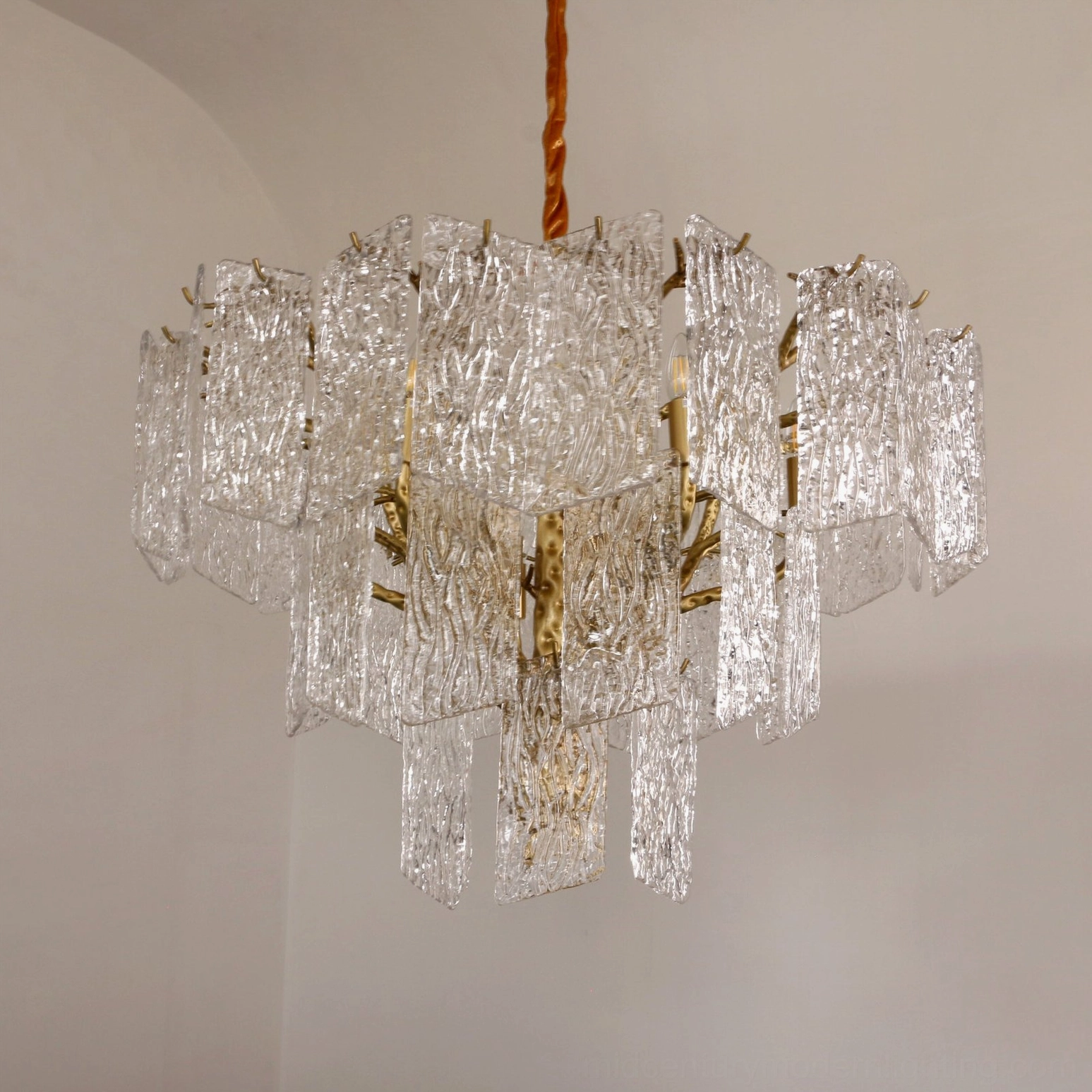 Piemonte chandelier close-up of textured glass panels with rippled surface detail and light refraction
