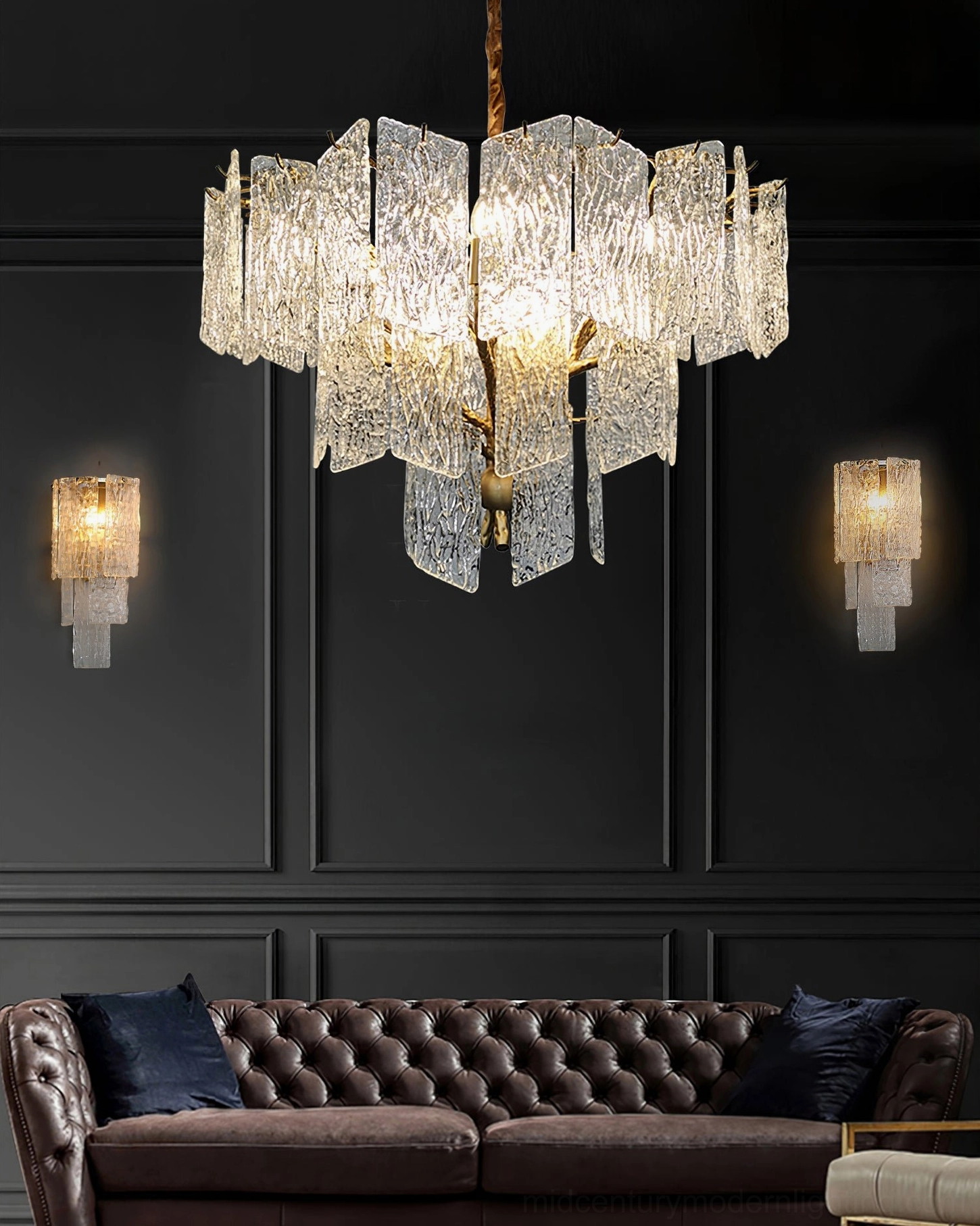 Piemonte glass chandelier as centerpiece in dark luxury living room with matching wall sconces and tufted sofa