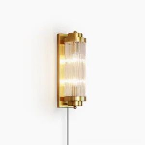 Pillar Offset wall sconce in gold finish with ribbed glass shade, frontal studio view showcasing Art Deco-inspired design