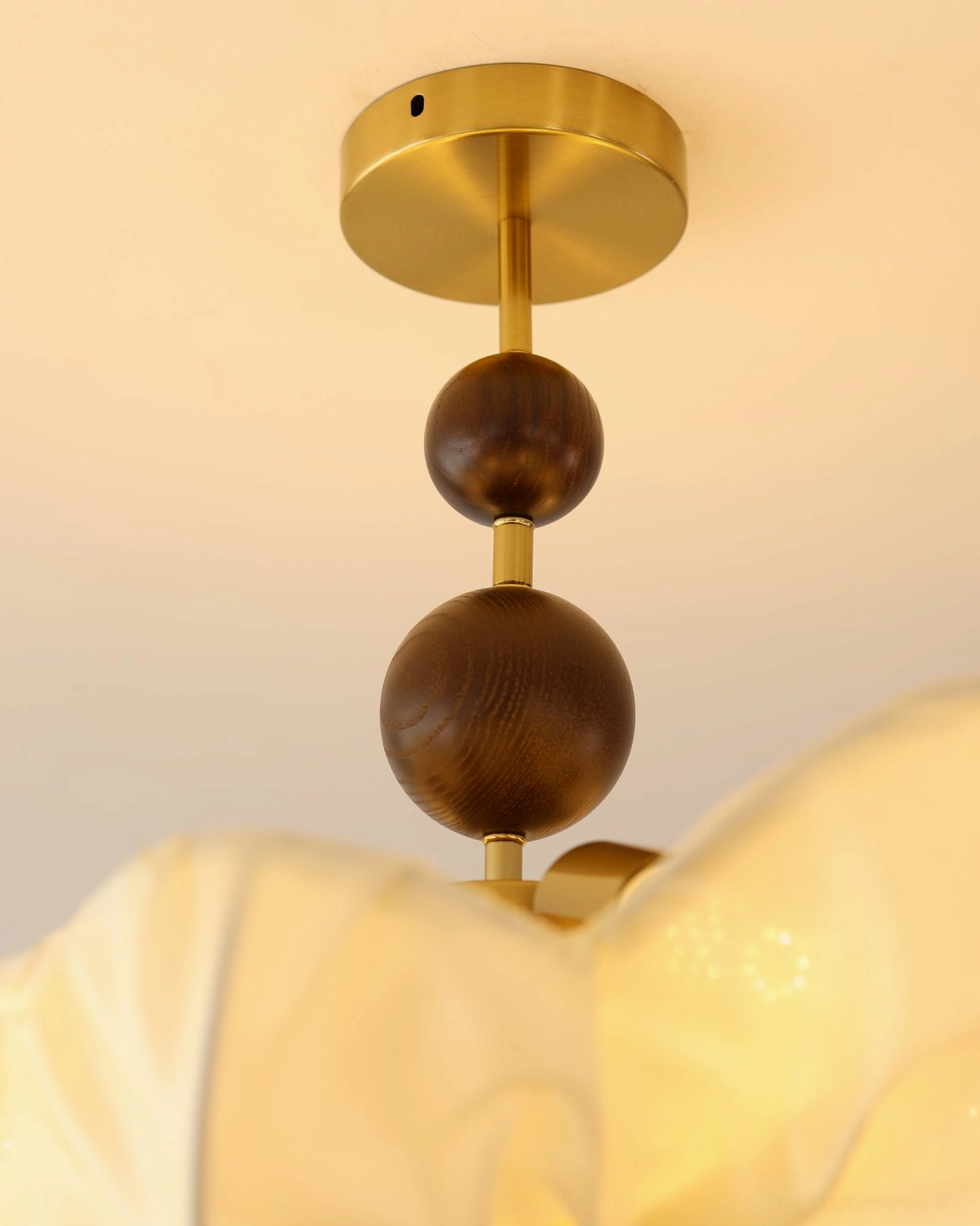 Pinctada ceiling pendant showing how fabric shade creates soft light diffusion and warm ambiance