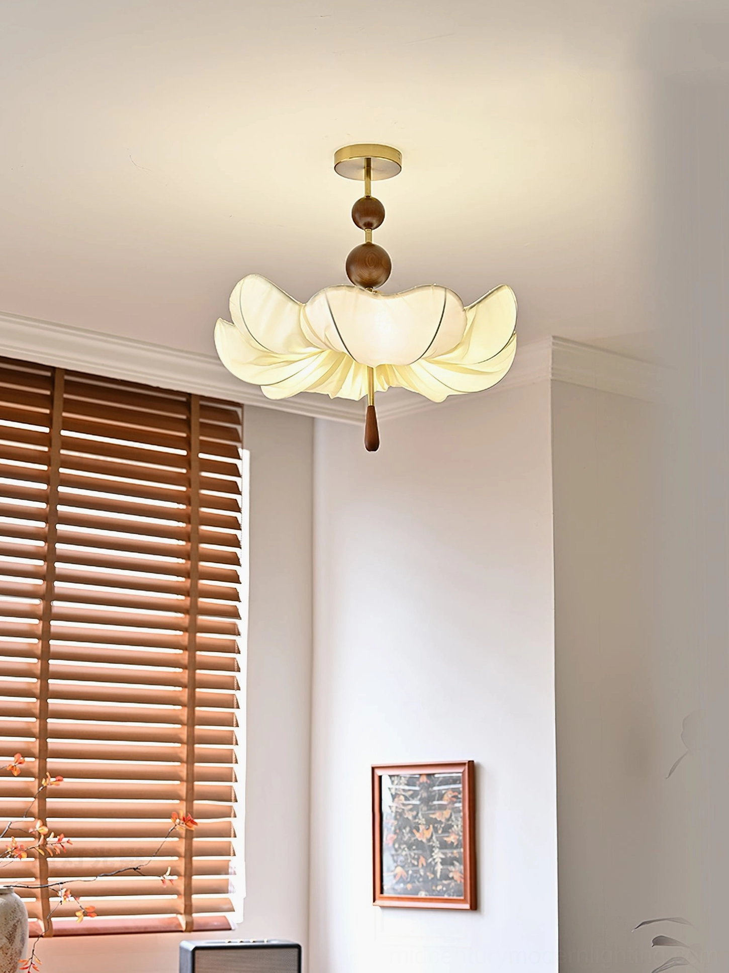 Pinctada ceiling pendant in bedroom setting with wooden blinds and wall decor, mid-century modern style