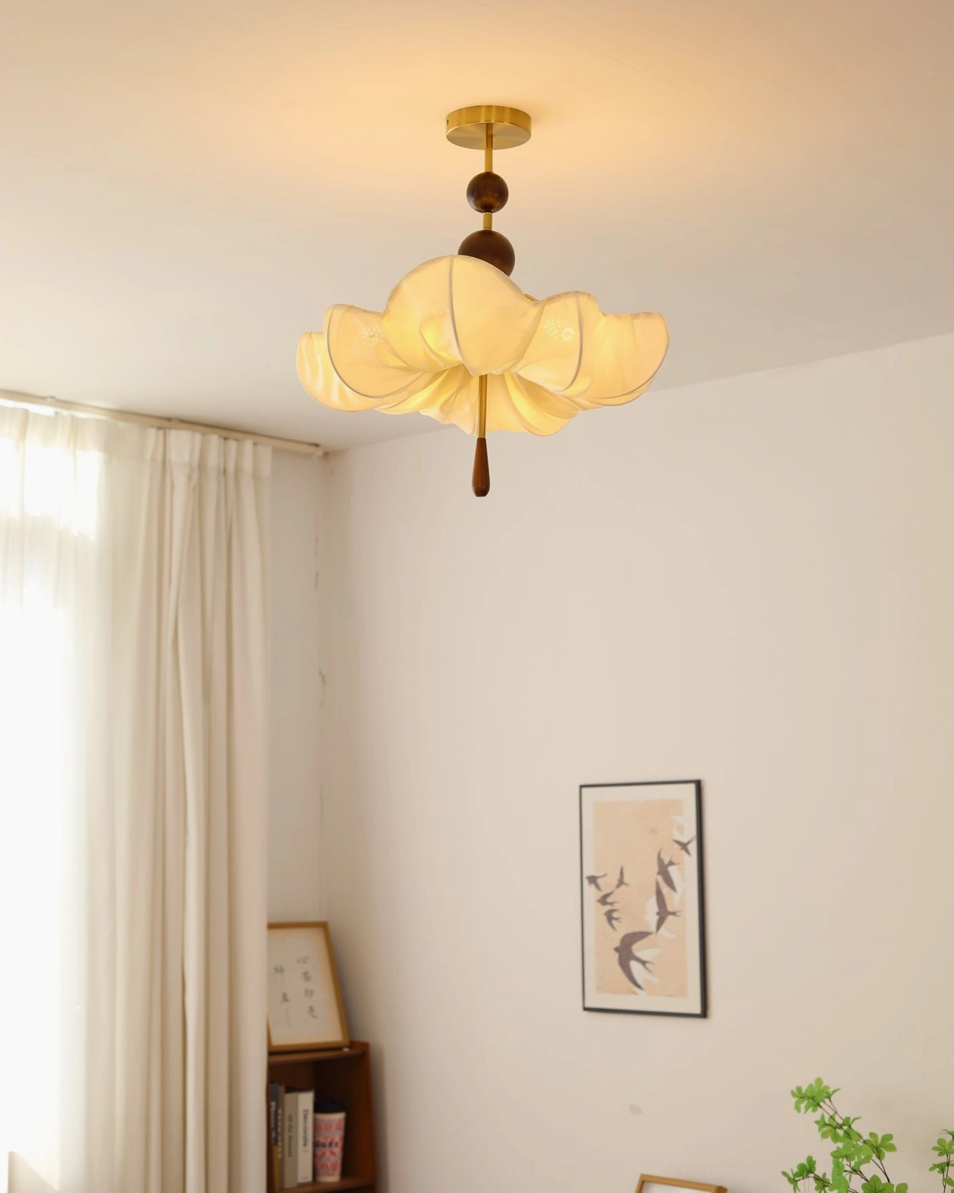 Pinctada pendant light in minimalist room with sheer curtain, glowing fabric shade creating soft warm ambiance