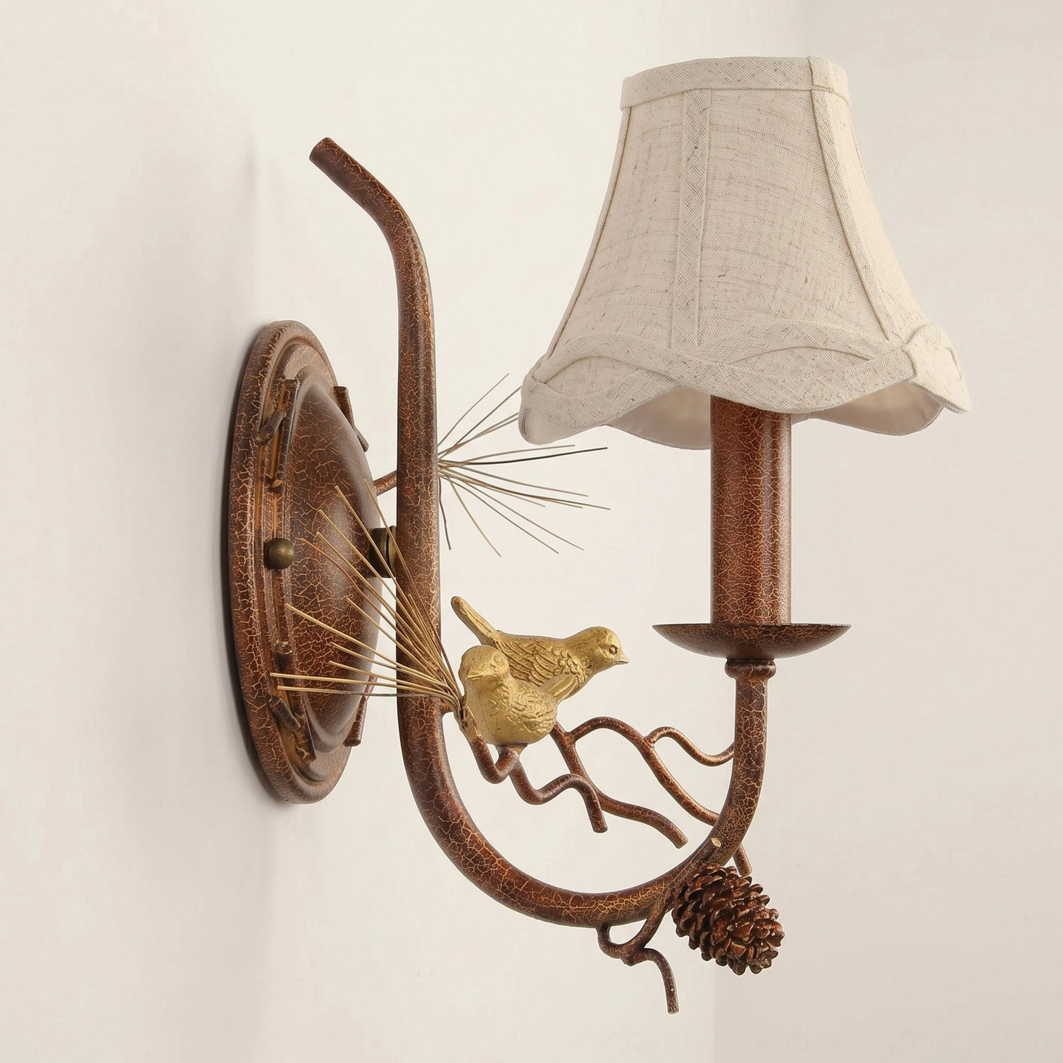 Pinecone Bird wall lamp fabric shade close-up showing warm light diffusion and textile quality