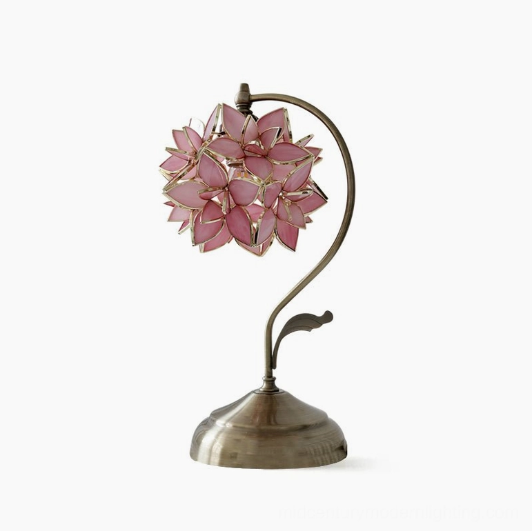 Pink capiz shell flower stained glass table lamp full product view, round bronze base and curved metal stem on white background