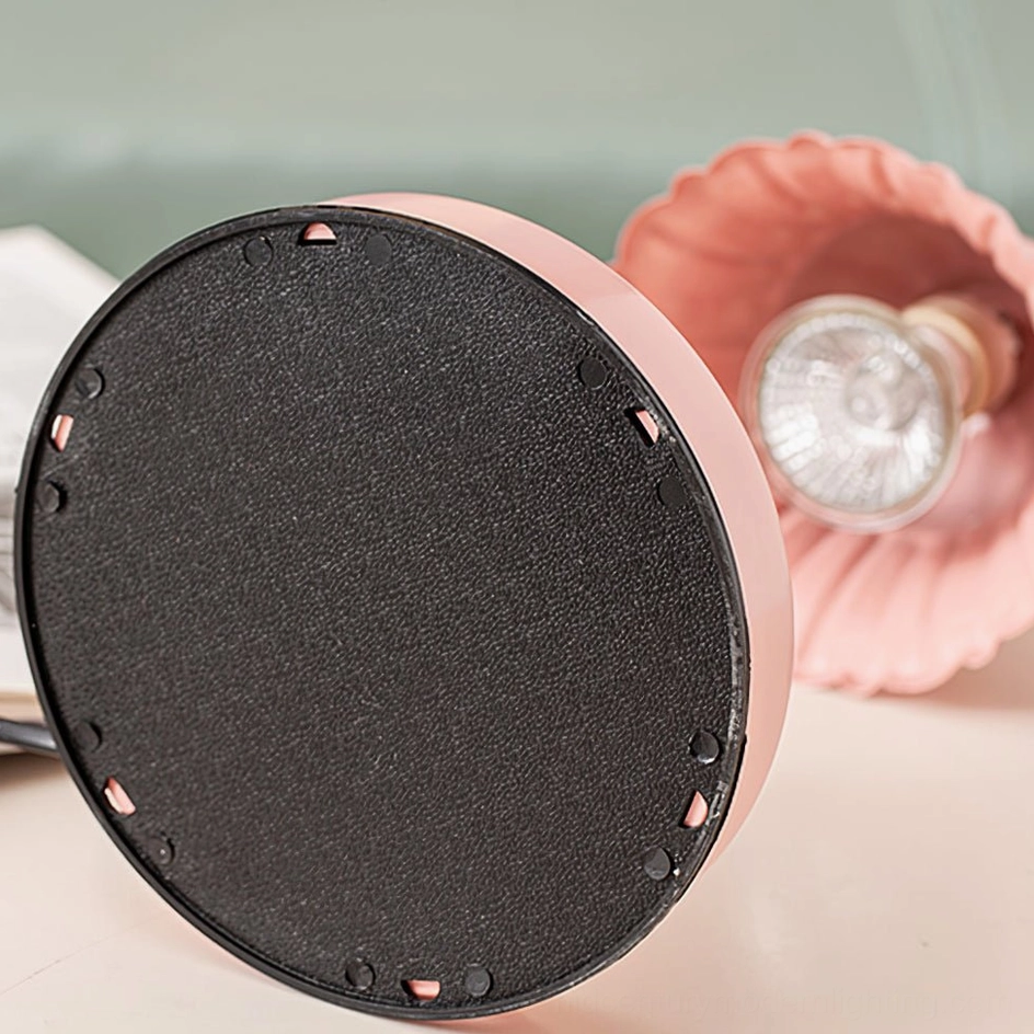 Overhead close-up of pink fluted ceramic lamp shade showing glossy finish and bell shape construction