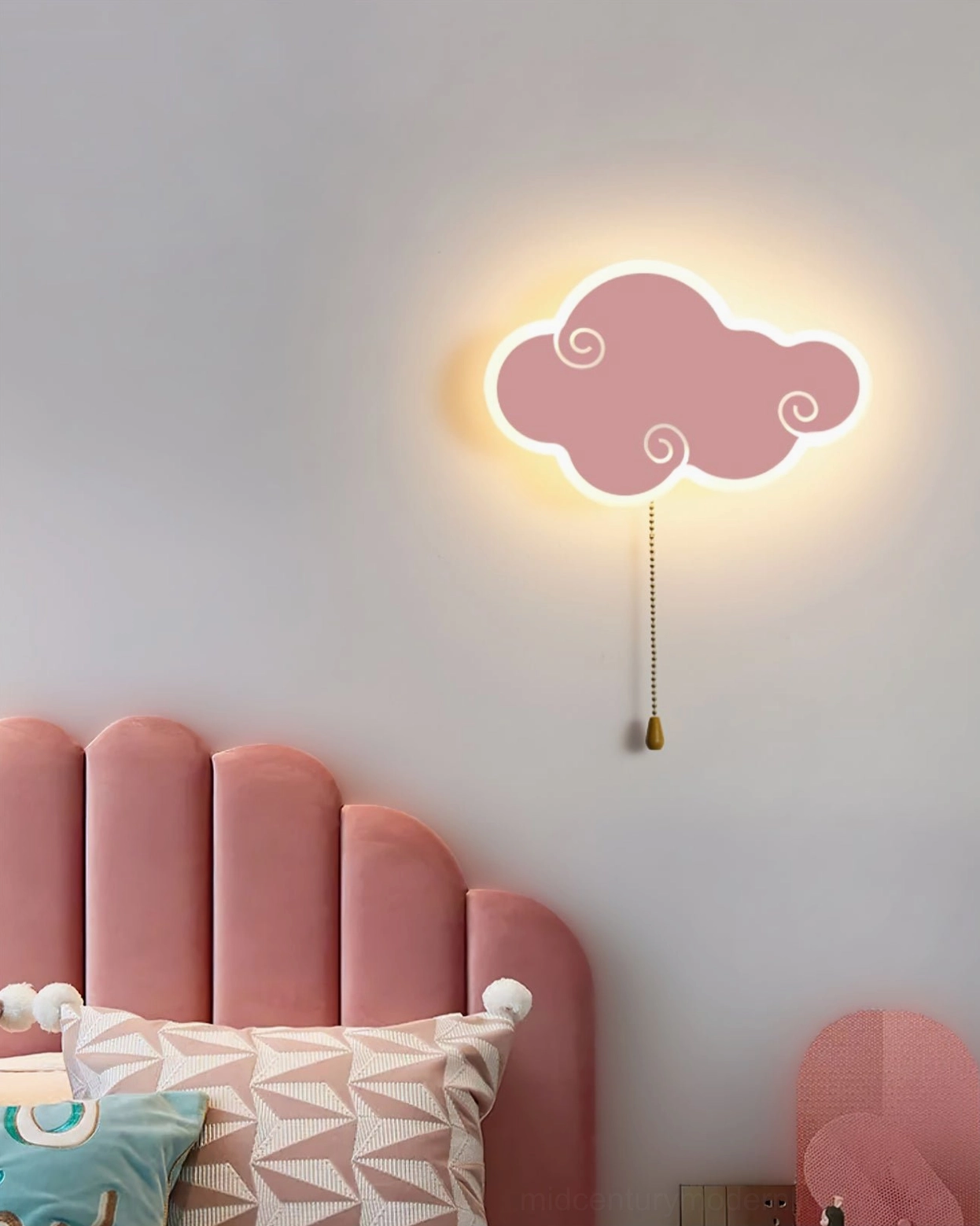 Pink cloud wall lamp coordinating with tufted headboard and soft pink girl's bedroom decor