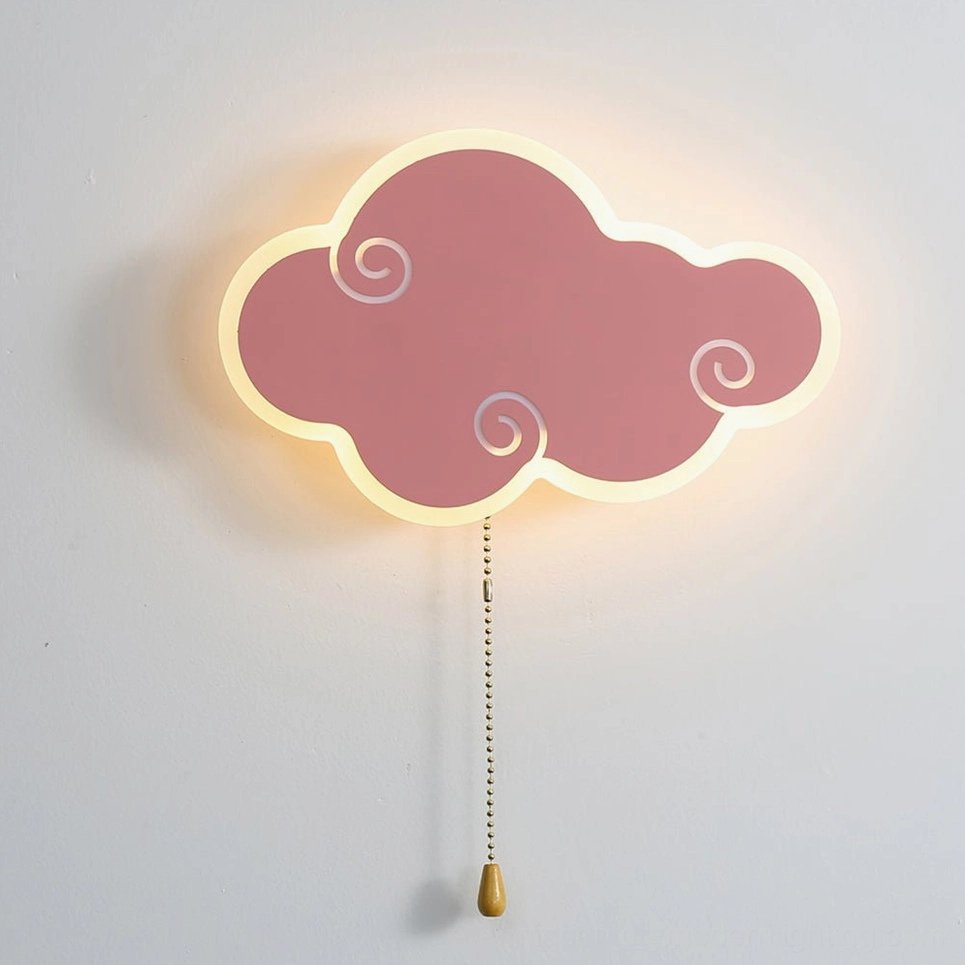Pink cloud-shaped wall lamp with soft warm light and golden chain detail in minimalist style
