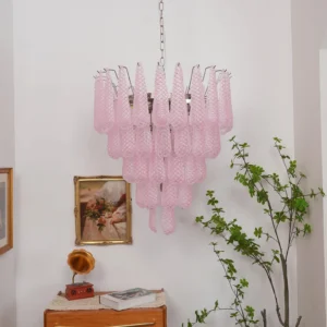 Pink glass dewdrop chandelier vintage living room three-quarter front view unlit matte finish