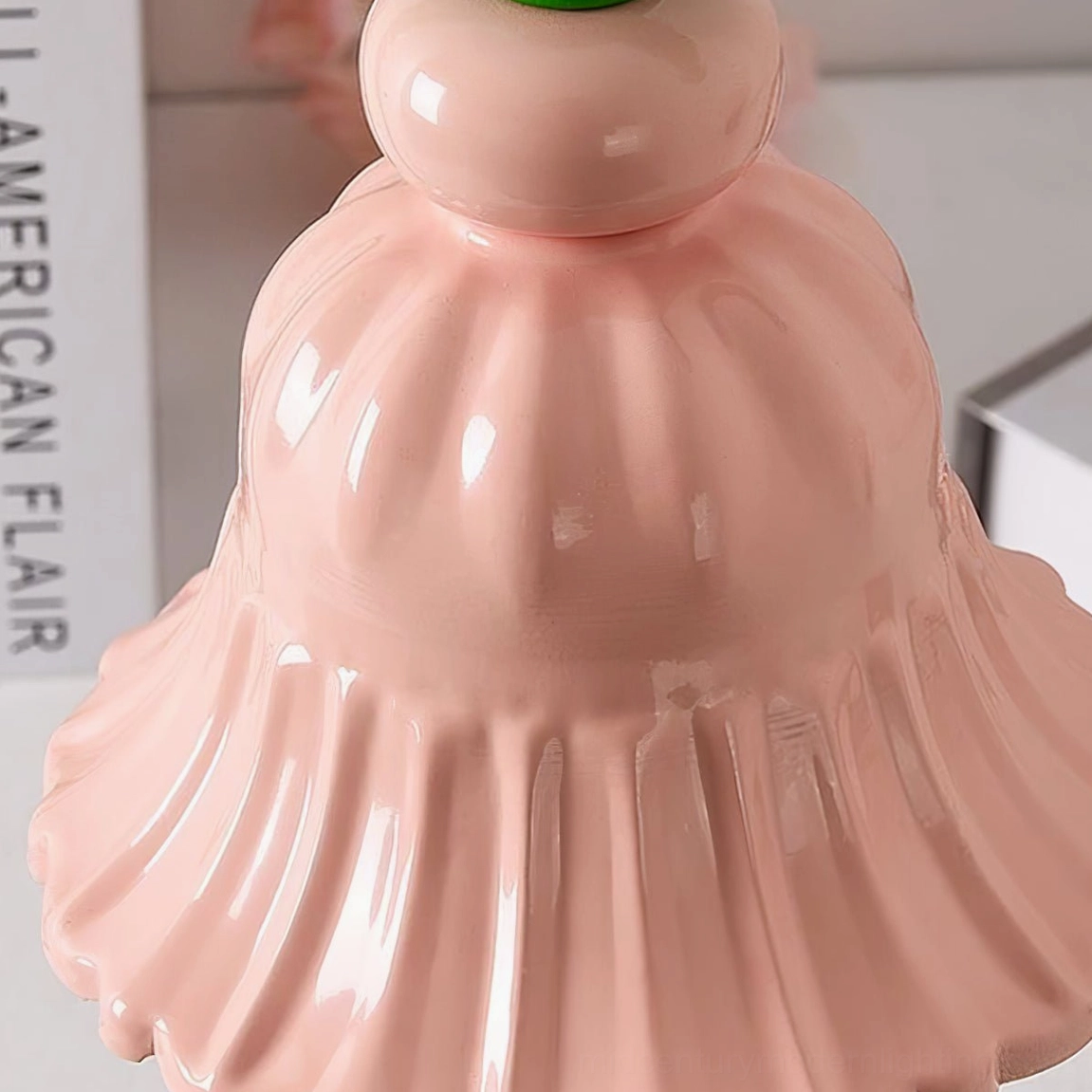 Overhead detail shot of pink fluted ceramic lamp shade with glossy finish and rounded top