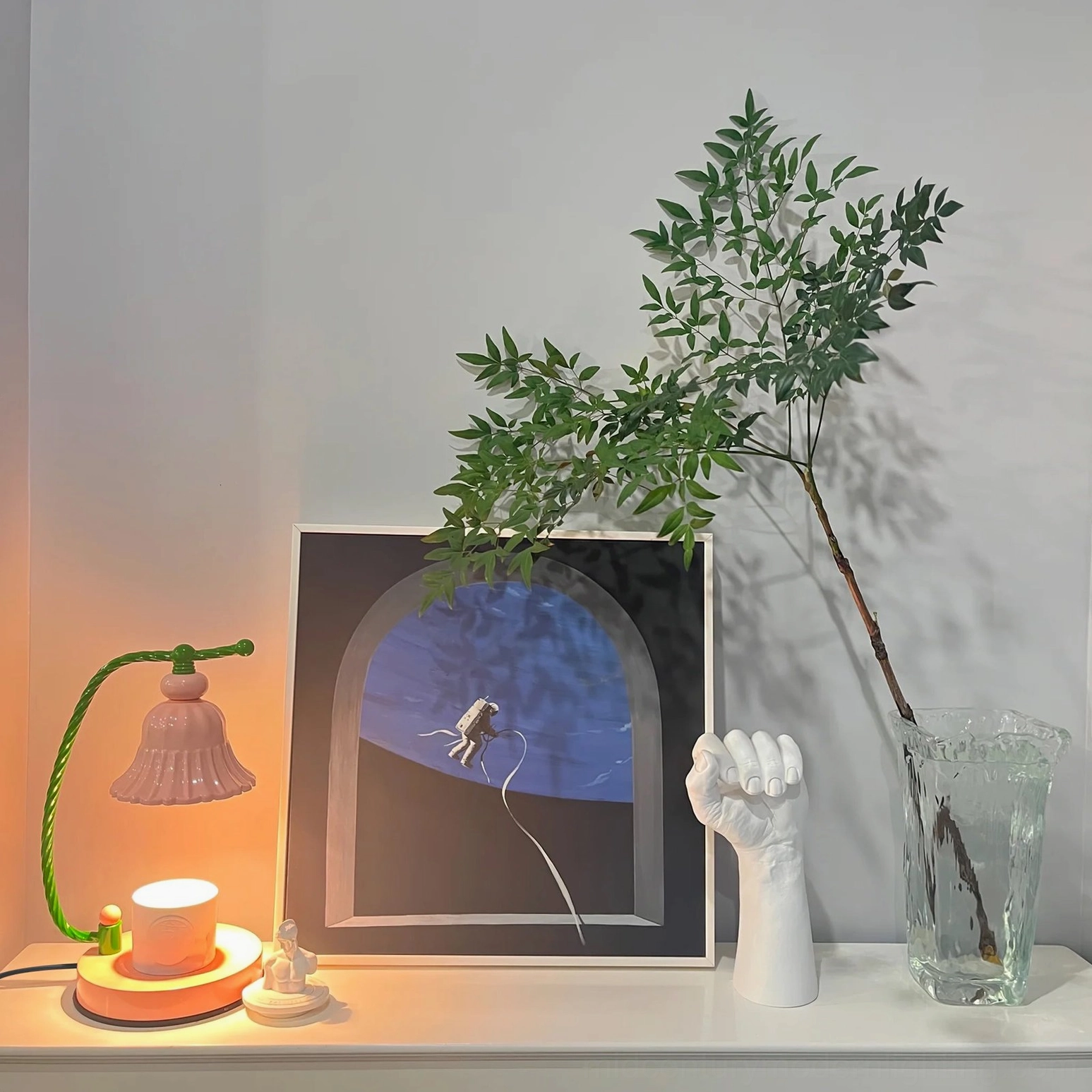 Pink ceramic fluted table lamp with warm white light glow for contemporary bedroom ambiance