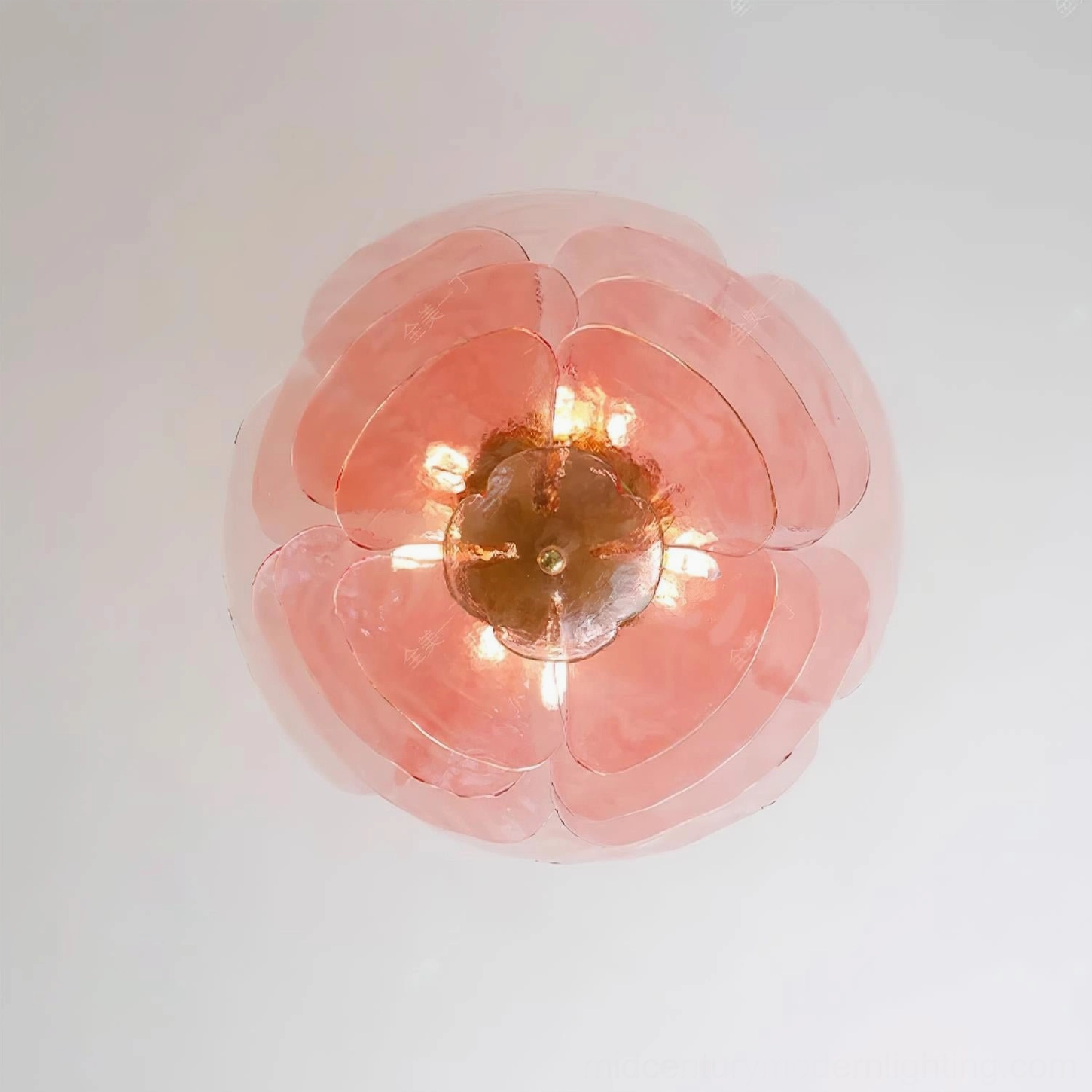 Pink translucent lotus flower flush mount light fixture with hand-blown glass petals and brass frame