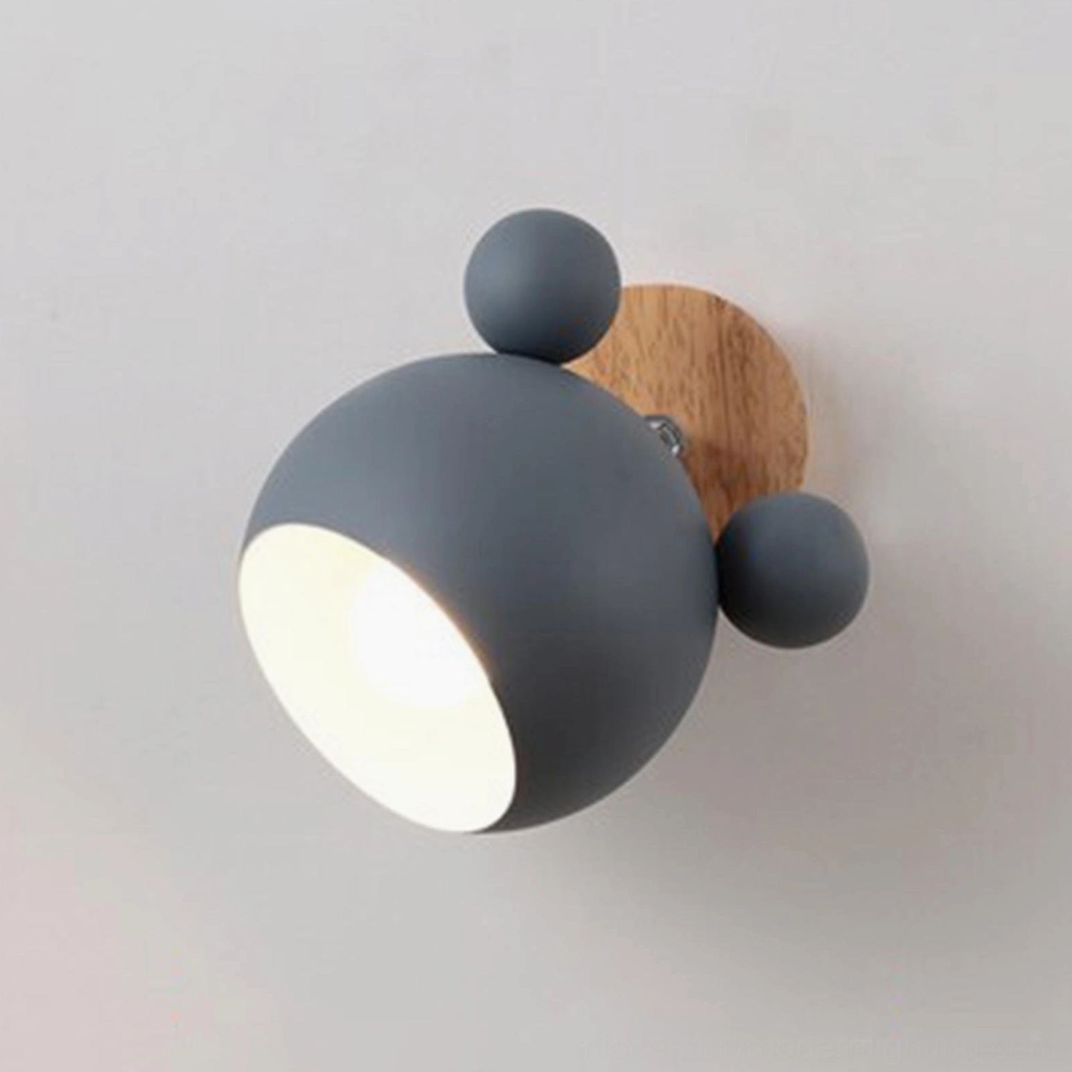 Pink mouse sconce in children's bedroom creating safe comfortable warm illumination
