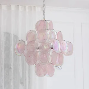 Elegant pink Murano glass chandelier three-quarter view with lace curtains interior design