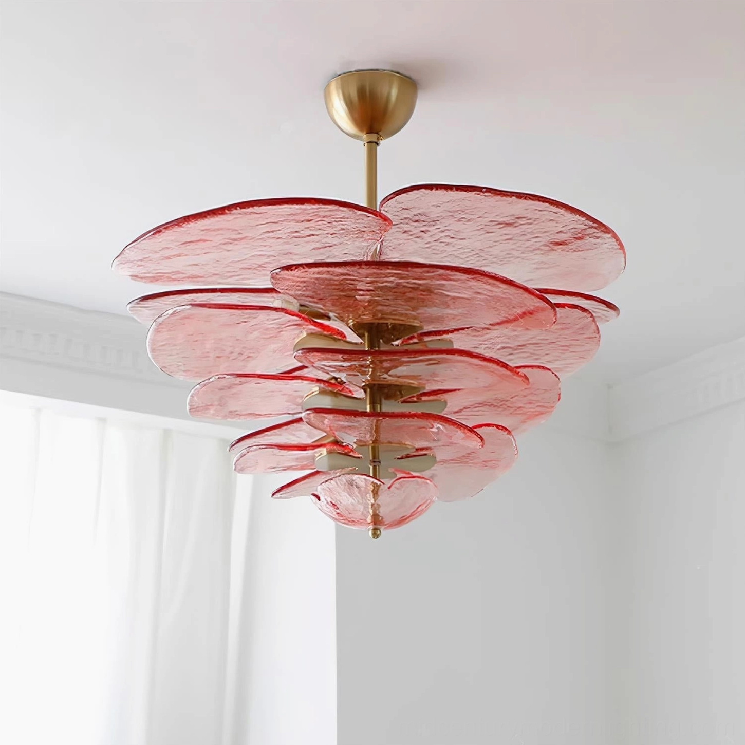 Pink rose-tinted hand-blown lotus leaf chandelier with textured art glass petals in modern room