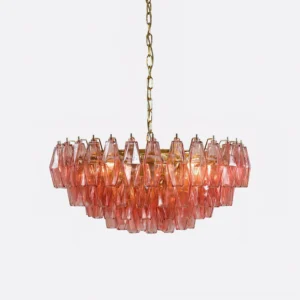 Close-up detail of pink faceted glass pendant layers and gold hardware on murano-inspired chandelier