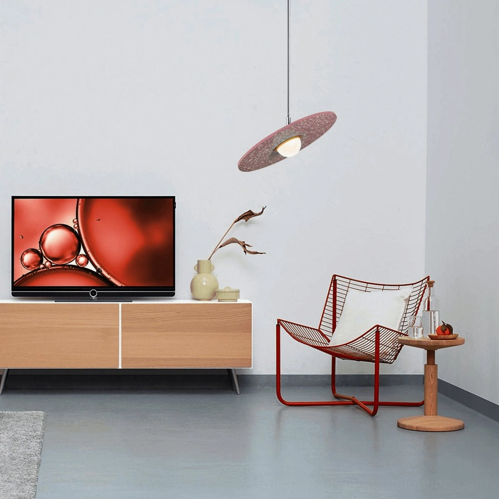 Pink terrazzo pendant light installed in modern Nordic minimalist living room with TV feature wall