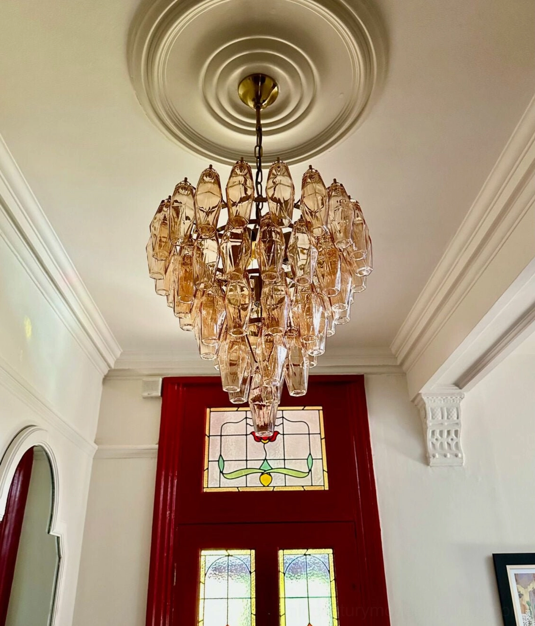 Tiered pink geometric crystal chandelier multi-angle view with prismatic glass composition