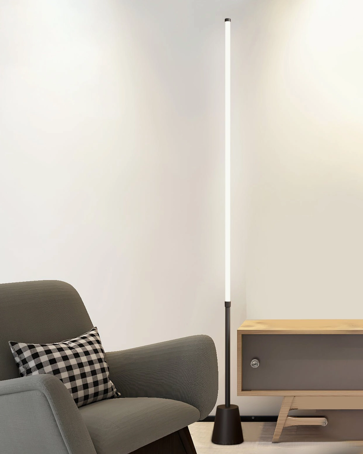 Architectural LED floor lamp in living room lounge, paired with grey armchair and side table, mid-century modern aesthetic