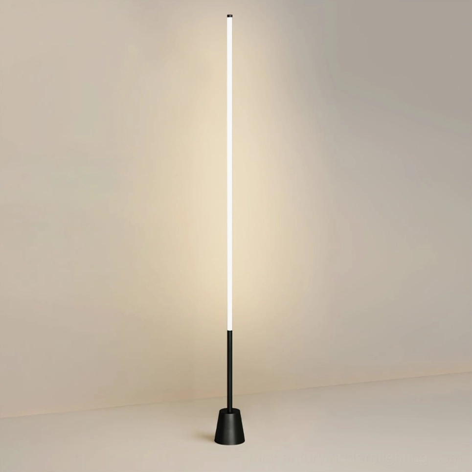 Modern black LED floor lamp in living space with warm glowing acrylic diffuser, contemporary interior styling