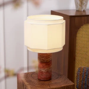 Pipito mid-century modern table lamp illuminated on wooden side table in contemporary home interior