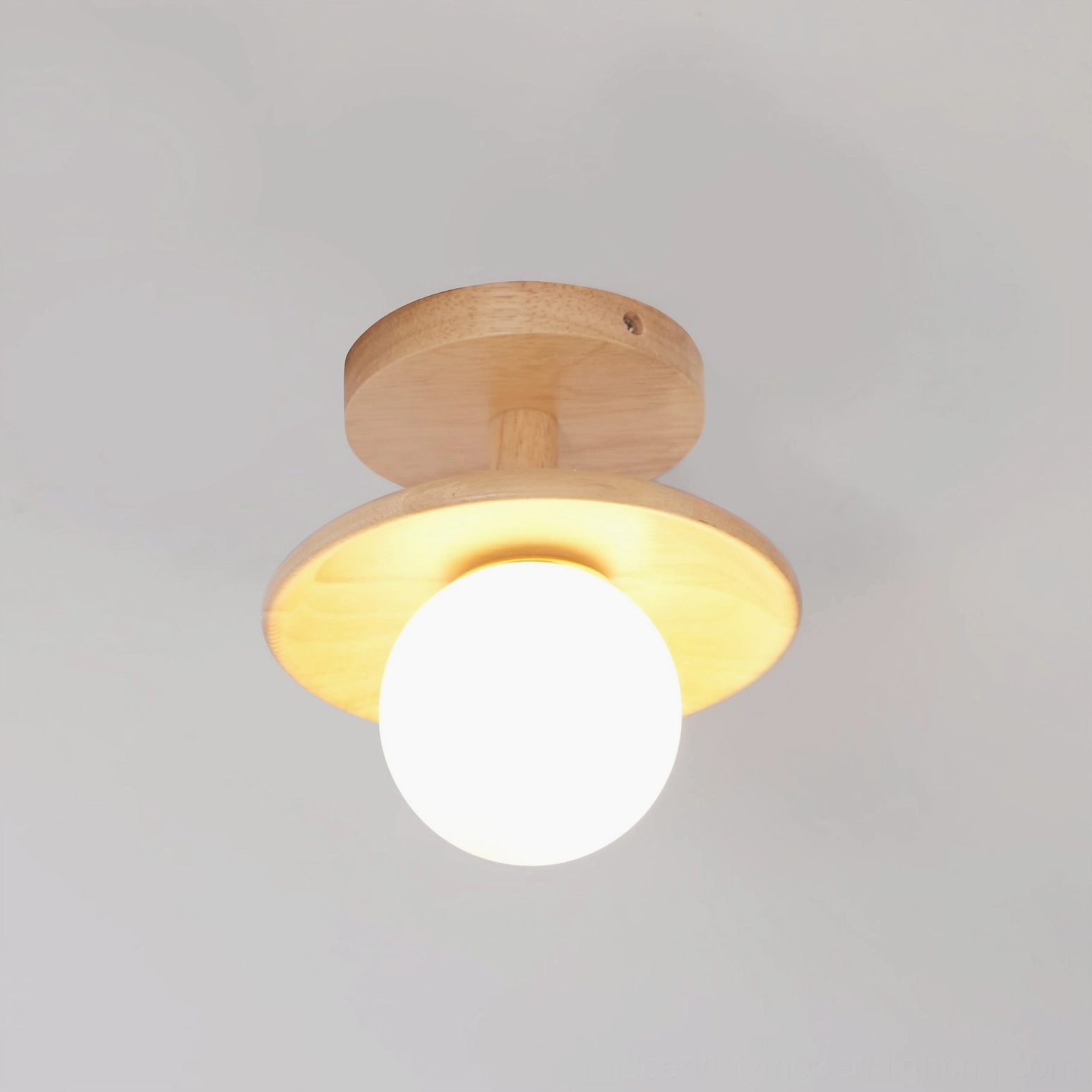 Plafon flush-mount ceiling fixture with natural ash wood base and frosted glass in modern interior