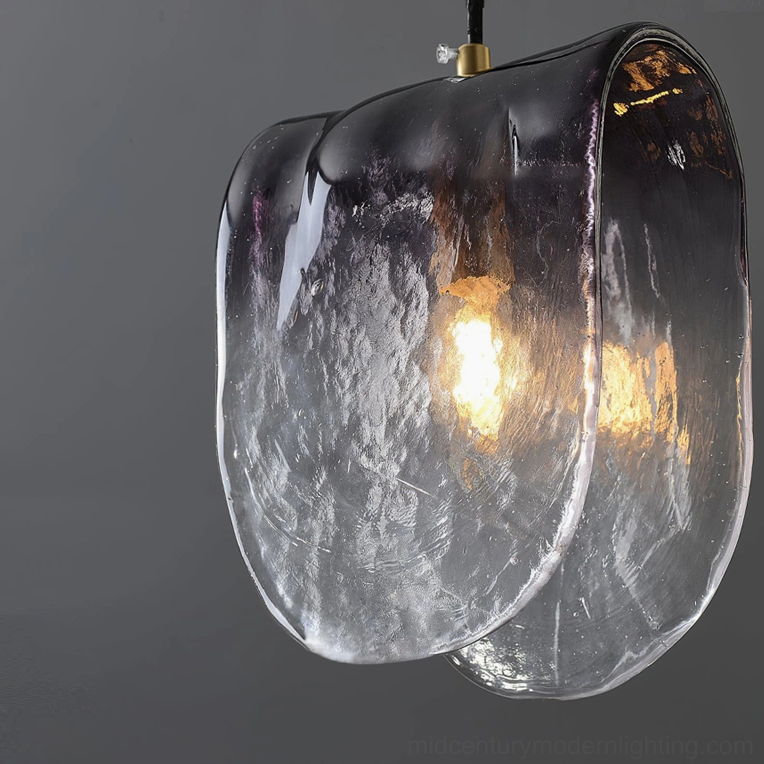 Close-up overhead view of Planck pendant shade showing water-ripple texture and purple rim gradient