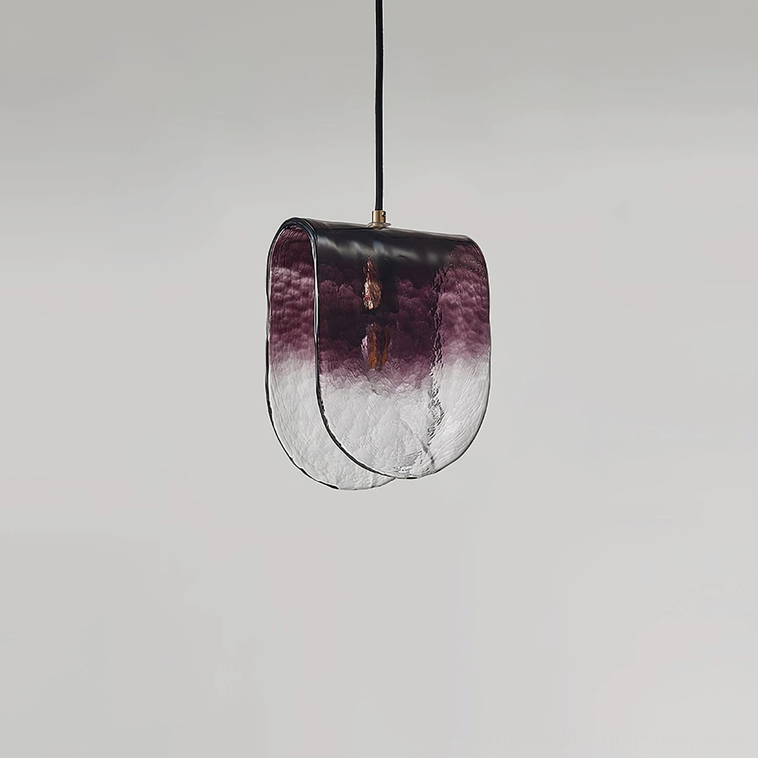 Planck pendant light styled in modern interior design setting with neutral color palette