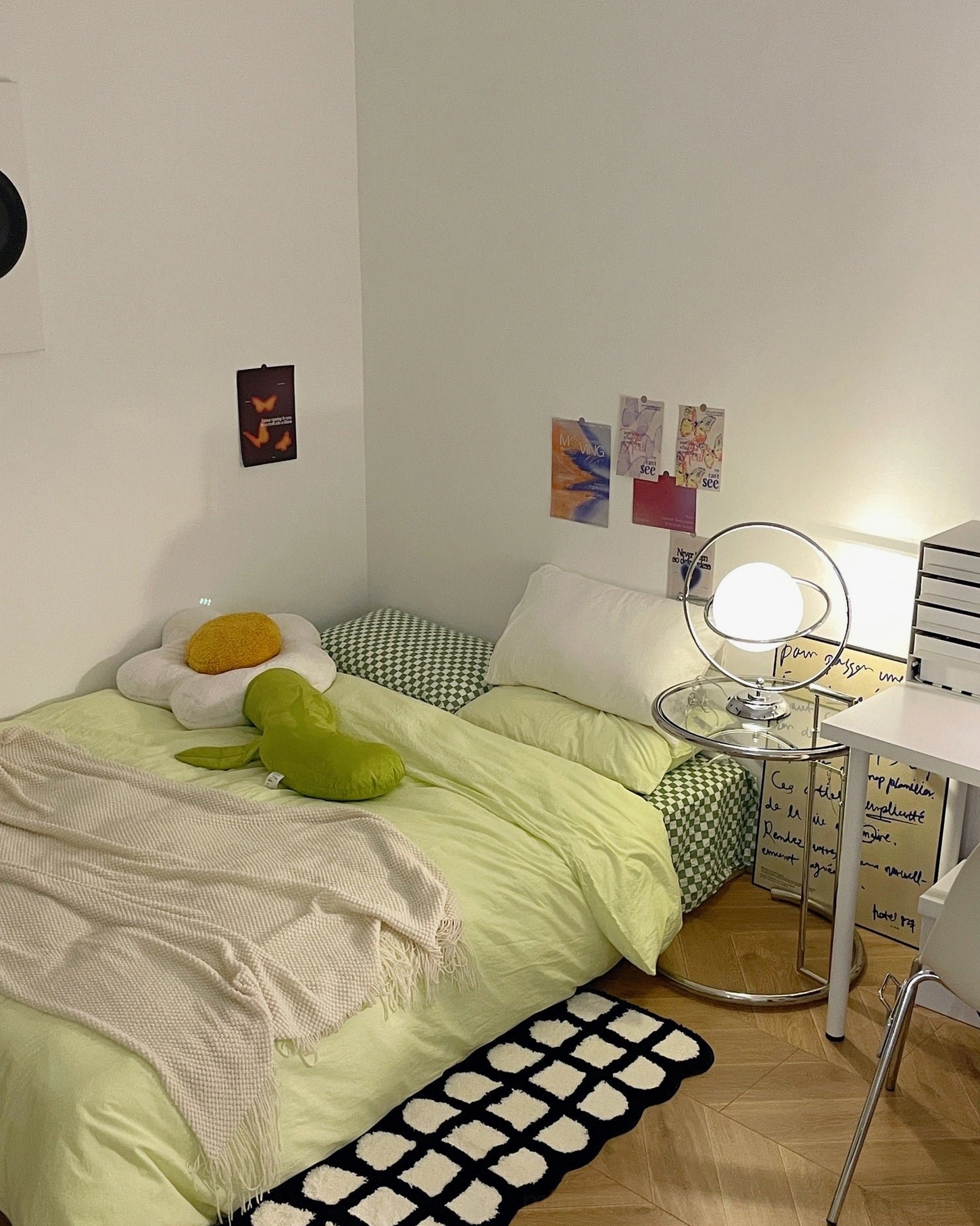 Modern planet table lamp bedside illuminating fresh green bedroom with soft ambient lighting