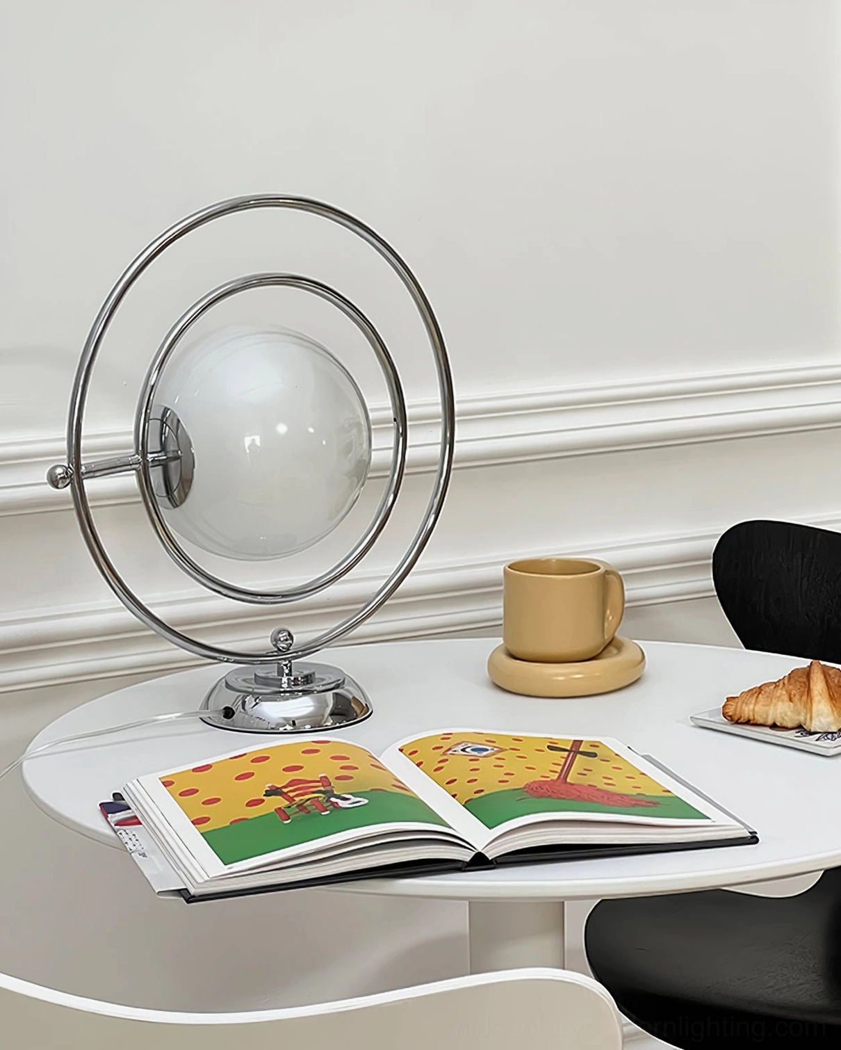 Planet table lamp creating cozy home ambiance on coffee table with books and warm lighting