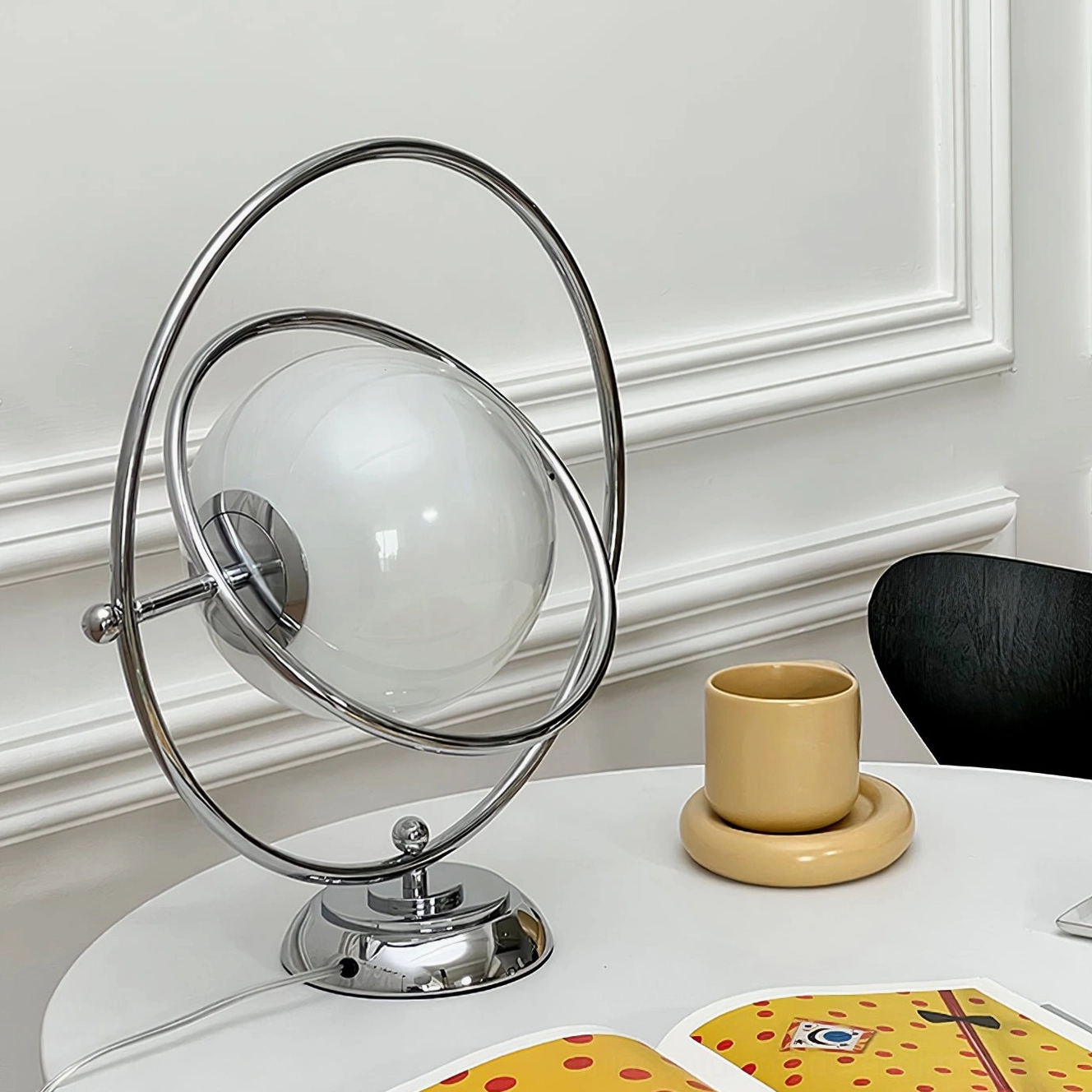 Planet lamp rotating orbital frame polished chrome base refined gallery quality