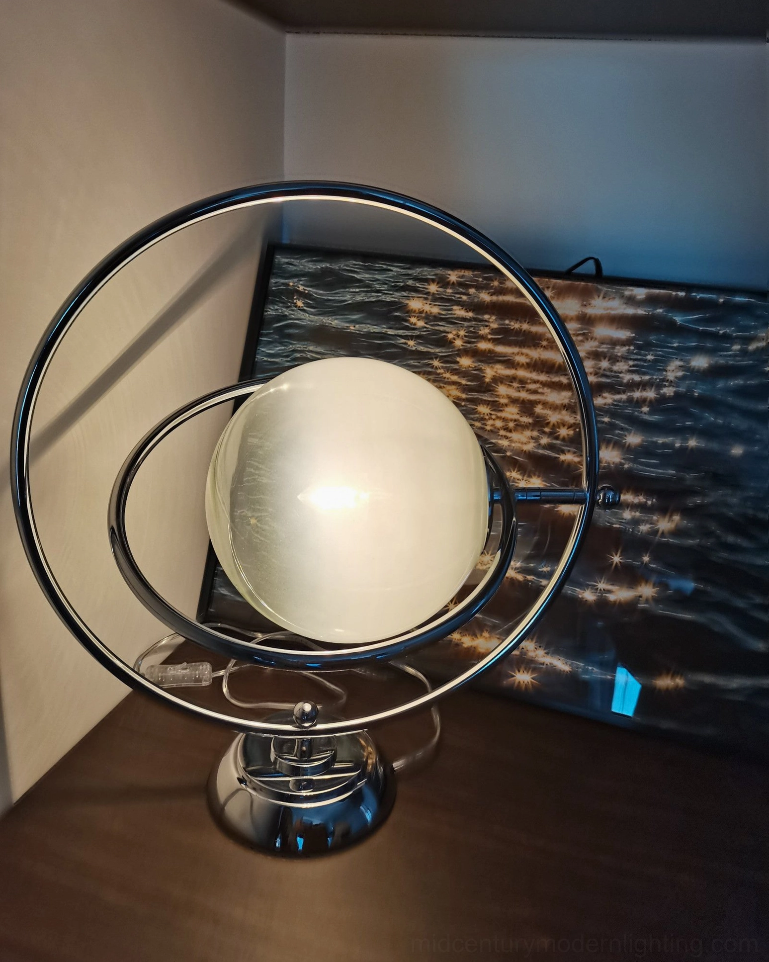 Planet lamp sculptural table top lighting piece with cosmic space age aesthetic