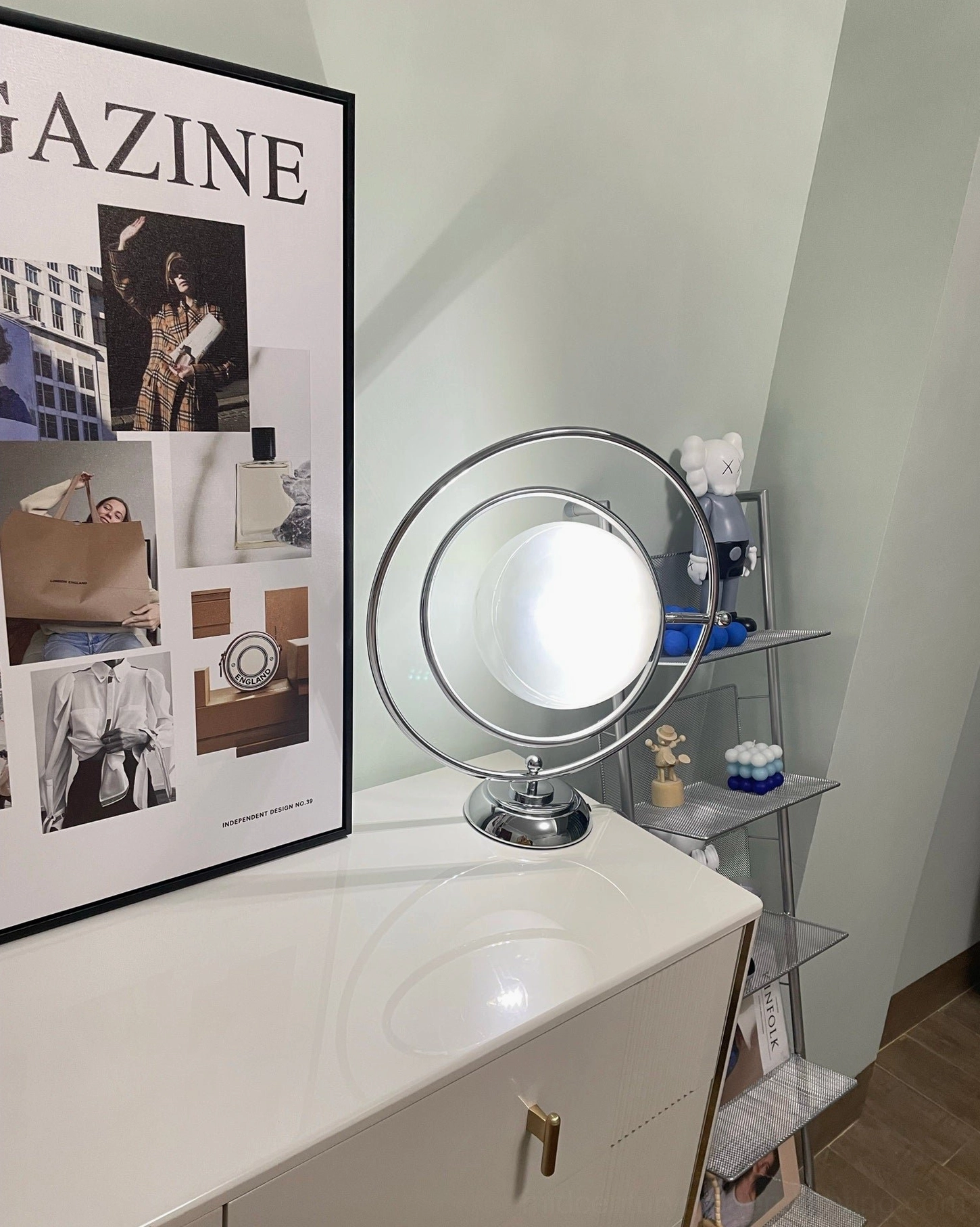 Mid-century modern planet lamp vanity display with geometric wall art and minimalist decor