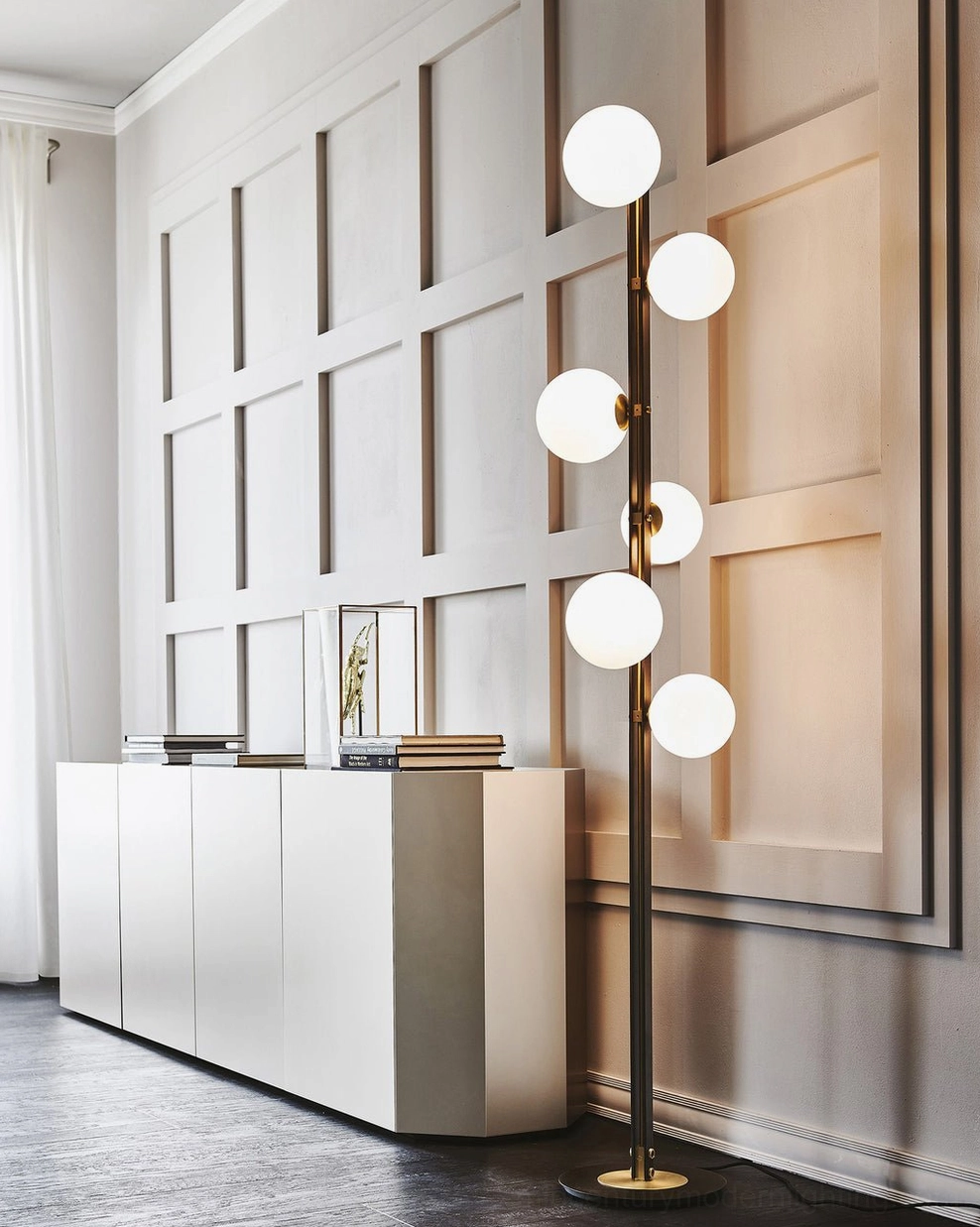 Top-down close-up of Planeta floor lamp round black base with brass center mount and hardware