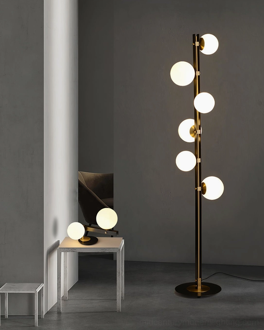 Two Planeta floor lamps with matching table lamps creating cohesive modern lighting design in minimalist apartment