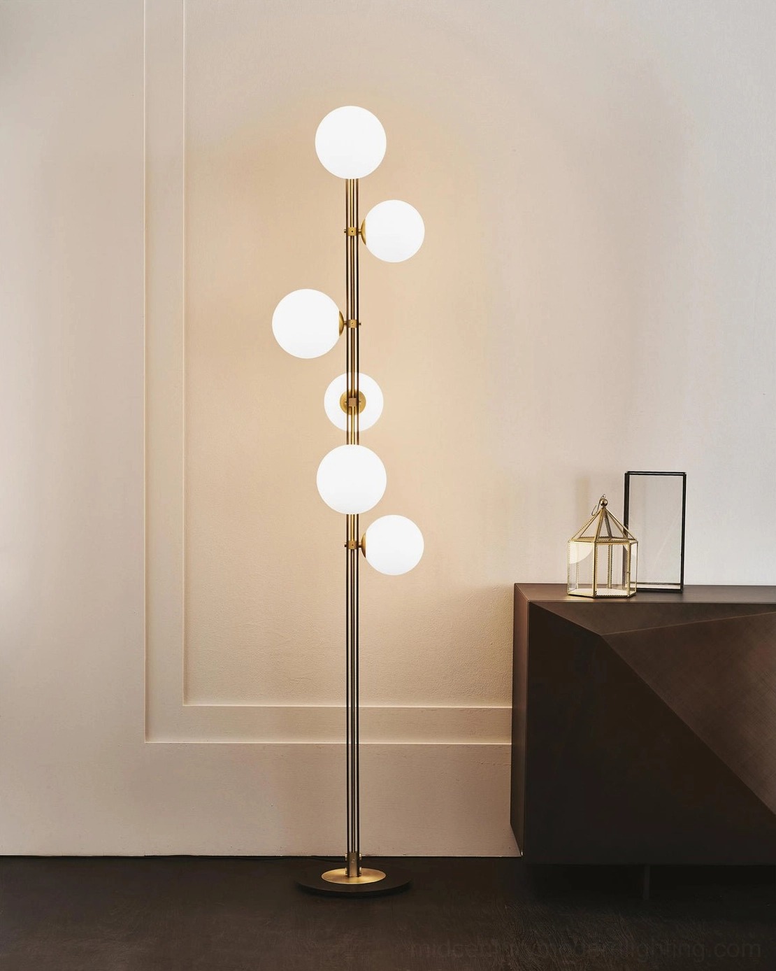 Planeta floor lamp displayed in minimalist living room with dark side table, showing side profile